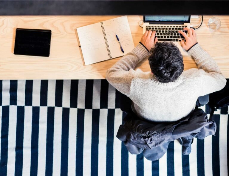 Billing specialist working through claims at a desk