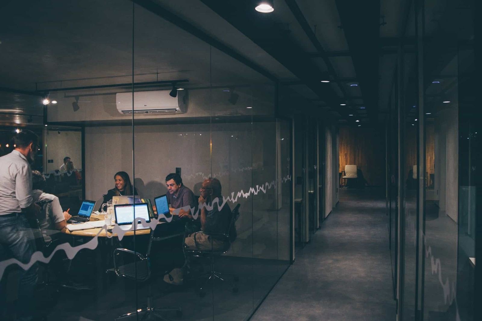 Team reviewing revenue reports in a meeting room